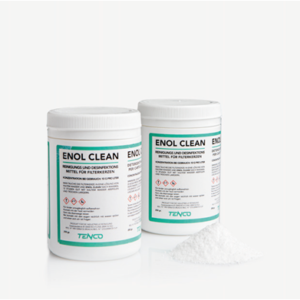 Two canisters of enol clean are sitting on a table.